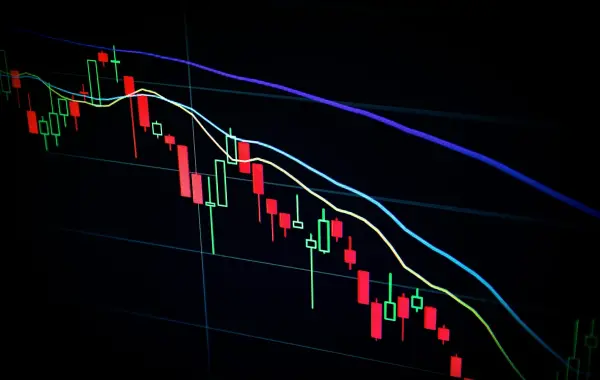 Schermi con grafici finanziari e dati di trading - AI nei mercati finanziari JPMorgan