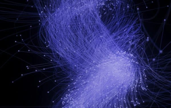 Illustrazione astratta di una rete di punti e linee blu su sfondo nero che richiama le reti neurali delle GAN