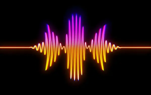 Onda sonora colorata su sfondo scuro che rappresenta la trascrizione vocale con intelligenza artificiale