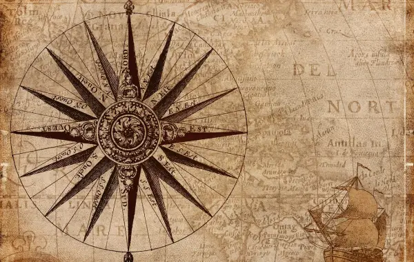 Bussola appoggiata su una mappa, simbolo di orientamento e valori guida